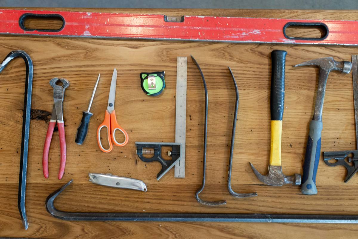 multi welder with plasma cutter in a home workshop cutting steel angle iron cleanly