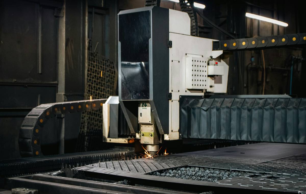 Close-up of plasma cutter trade tools in action on steel plate